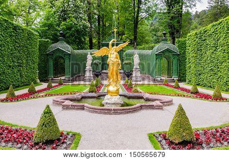 Sculpture Of Gold Angel In The Park Of Linderhof Palace, Bavaria