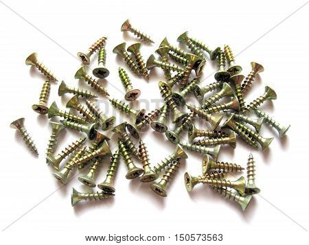 Screws isolated on white background. Screws on white background. Scattered screws. Construction and repair.