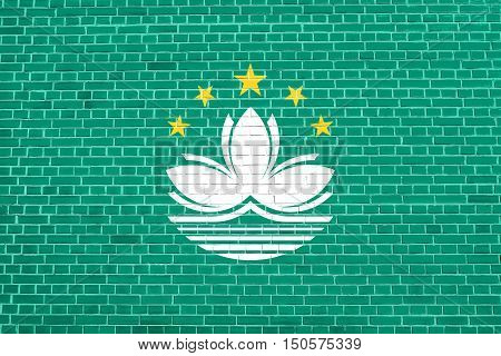 Macanese official flag. Patriotic chinese symbol banner element background. Macau is special region of PRC. Flag of Macau on brick wall texture background, 3d illustration