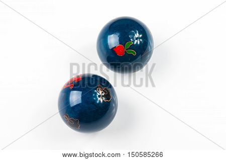 pair of blue Chinese singing balls Baoding of health for hands on white background