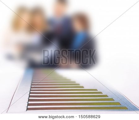Stock Market Graph With Going Up Arrow  on the background of business team