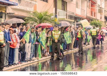 Banos De Agua Santa Ecuador - 23 June 2016: Group Of Supporters With Police Men Of Ecuador Waiting For The President Rafael Correa Delgado In Banos De Agua Santa Ecuador South America