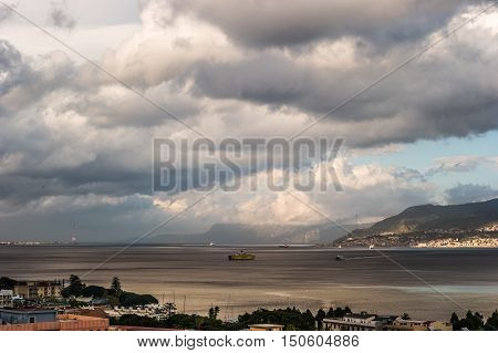 The Messina Strait seen from Sicily Italy. Beautiful moving clouds over vast spaces.
