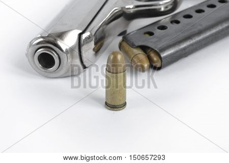 Pistol and ammunition on the white background.