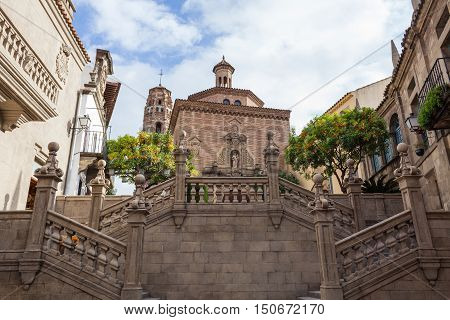 BarcelonaSpain - January 13 2016: Spanish town (Poble Espanyol) - architectural museum under the open sky. The museum features exhibits on contemporary art with streets houses parks theater school restaurants and artisan workshops.