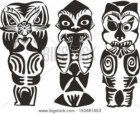 Set of three black and white New Zealand Maori totem figures - human ghosts and animalistic deities of natural forces