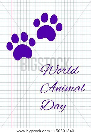 Dog footprint on notebook paper. World Animal Day.