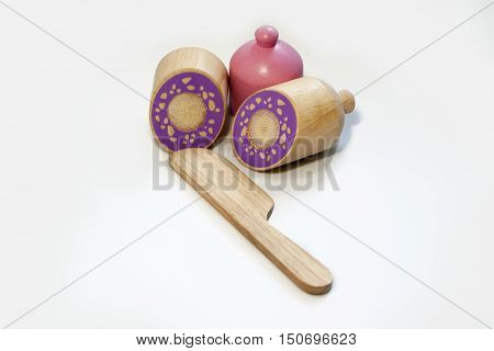 Kids toy sausage cut into pieces isolated on white.