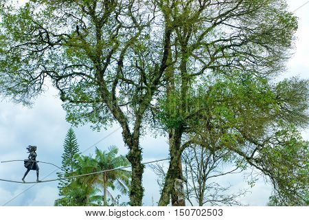 MANIZALES COLOMBIA - JUNE 1: Statue of a woman walking on a tightrope in a park in Manizales Colombia on June 1 2016