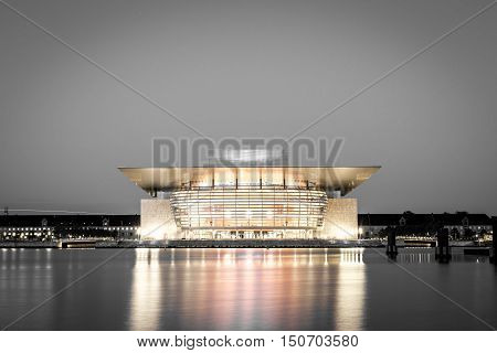 Copenhagen, Denmark - June 05, 2016: The illuminated Opera House designed by Henning Larsen architects in black and white