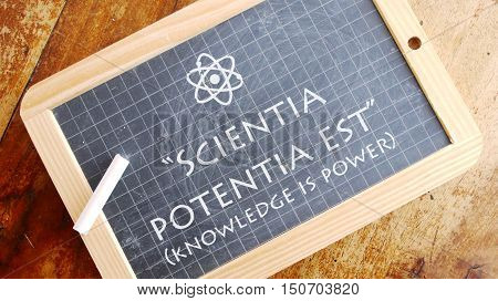 Scientia potentia est. Latin aphorism meaning Knowledge is power.