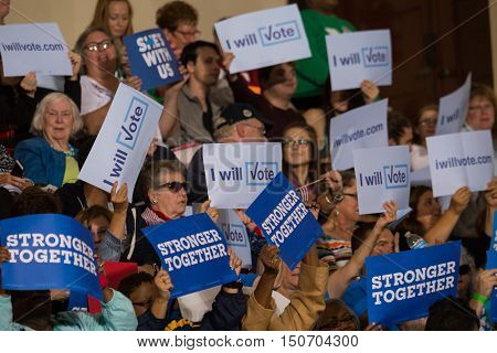 Harrisburg PA USA - October 4 2016: Supporters waving I will Vote Signs at the rally for Presidential candidate Hillary Clinton.