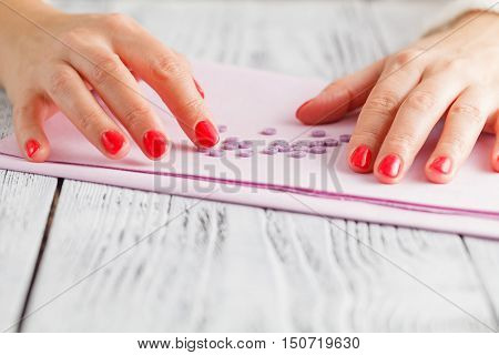 Colorful sewing buttons (clasper) on pink cloth