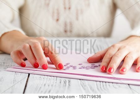Colorful sewing buttons (clasper) on table with cloth