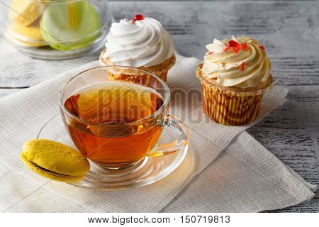 French Colorful Macarons With Cup Of Black Coffee. Sweet Delight. Food And Drink. Vertical Compositi