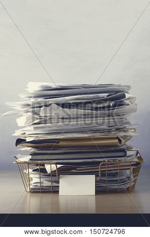Wire Office Tray Piled Up With Papers