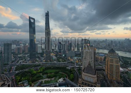 SHANGHAI - AUG 13, 2015: Jin Mao Tower, Shanghai tower, Shanghai World Financial Center at evening, view from IFC hotel, 990 skyscrapers are in Shanghai