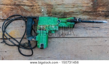 Electric hammer Plugger. on the old wood