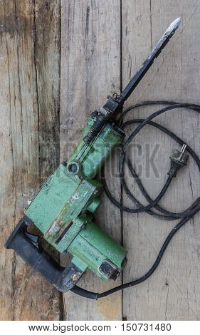 Electric hammer Plugger. on the old wood