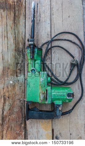 Electric hammer Plugger. on the old wood