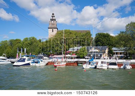 NAANTALI, FINLAND - AUGUST 27, 2016: Sunny august day in the old harbour of Naantali. Tourist landmark of the city Naantali, Finland