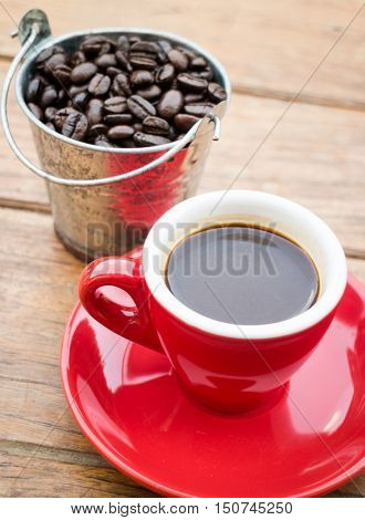 Red cup of espresso on wooden table stock photo