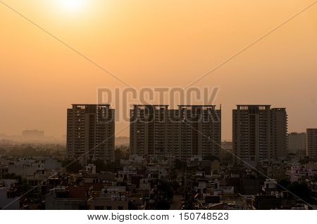 Dawn over gurgaon delhi showing the buildings in various stages of construction. The development of the city has led to a boom in infrastructure projects