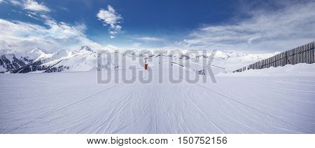 Panoramaview To Ski Slopes And Skiers Skiing In Kitzbuehel Mountain Ski Resort With A Background To