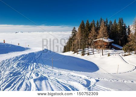 KITZBUEHEL AUSTRIA - February 18 2016 - Alpine chalet covered by snow in Kitzbuehel ski arena Austria