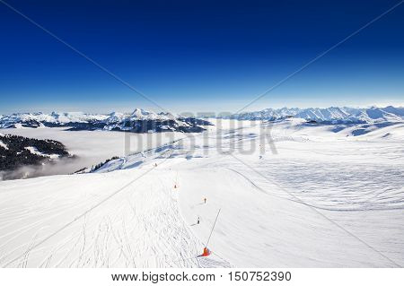 View to Alpine mountains in Austria from Kitzbuehel ski resort - one of the best ski resort in the workd with 54 cable cars 170 km prepared skiing slopes and place of famous hahnenkamm races.