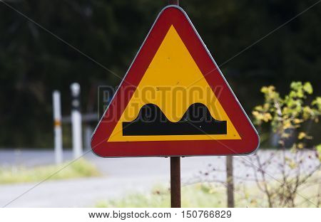 a swedish roadsign warning for an uneven surface