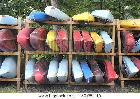 Kayak stacked on a wooden rack in Michigan