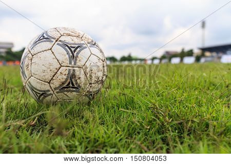 Nakhon Ratchasima Thailand - October 1 : Muddy soccer ball on a football field in Municipal Stadium Nakhon Ratchasima on October 1 2016 in Thailand.
