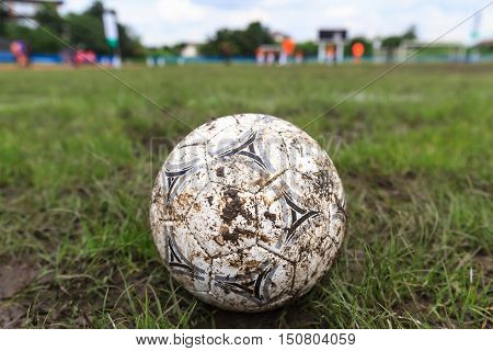 Nakhon Ratchasima Thailand - October 1 : Muddy soccer ball on a football field in Municipal Stadium Nakhon Ratchasima on October 1 2016 in Thailand.