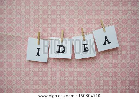 White Sheets Of Paper On A Pink Background, White Sheets On Clothespins