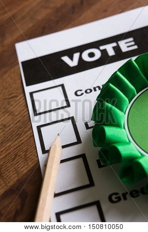 Green Political Rossette On Ballot Paper For Election