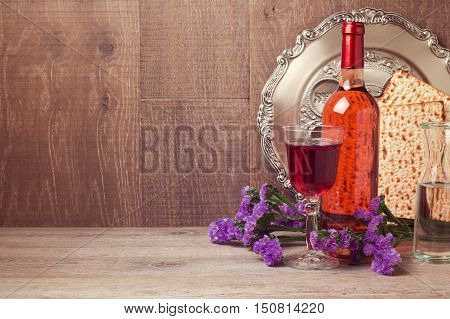 Jewish holiday Passover background with matzoh and wine bottle