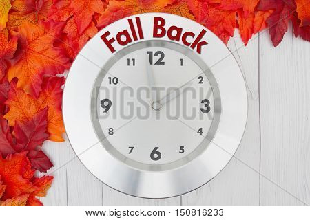 Fall Time Change Some fall leaves and a clock on weathered wood with text Fall Back