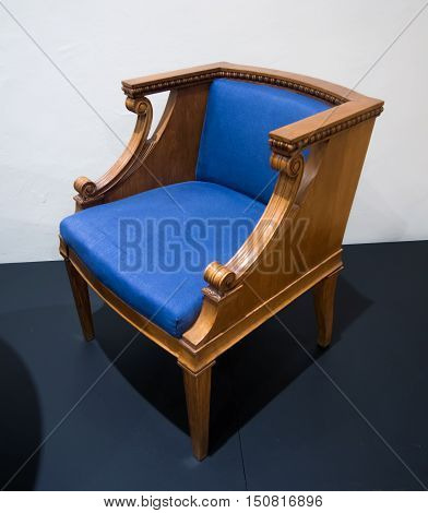Old chair with blue upholstery from the era of Soviet times