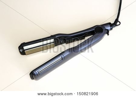 Hair straightener .Hair care, hairdresser, makeup artist.