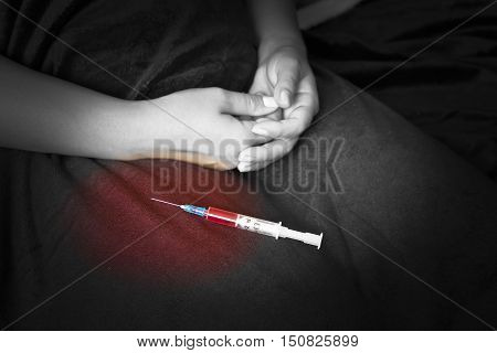 Stabbing drugs. the syringe and the hand enters injections, drugs, doping.