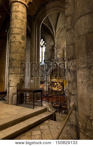 Poitiers France - September 12 2016: Very old church Notre Dame la Grande in Poitiers France in the interior of one of the side altars with a statue of the Virgin Mary with Jesus
