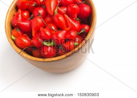 Biquinho Pepper into a bowl. Capsicum Chinense isolated in white background