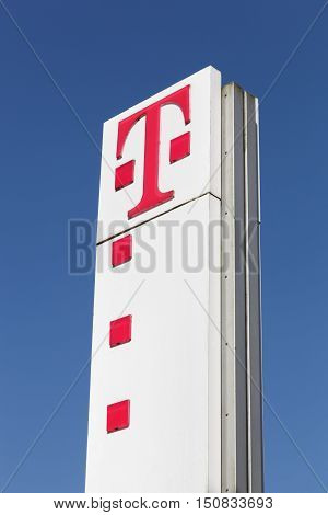 Flensburg, Germany - June 4, 2016: Deutsche Telekom sign on a panel. Deutsche Telekom is a German telecommunications company headquartered in Bonn