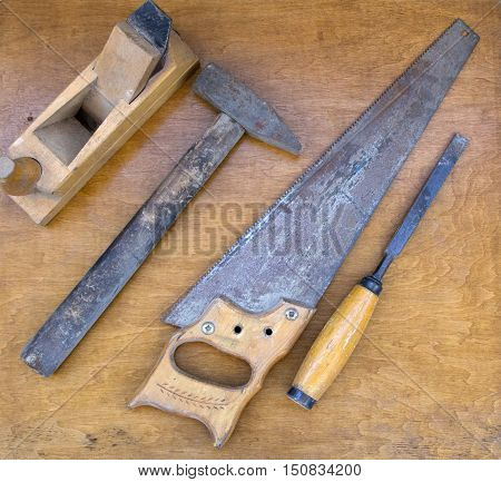 Closeup of assorted work tools on wood