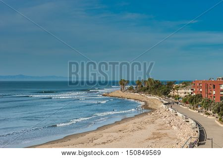 Ventura promenade boardwalk along the high tide shore.