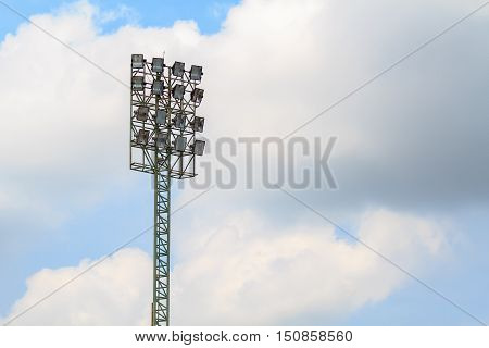Sport stadium floodlights on a cloudy background. Soccer stadium lighting.