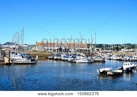 AXMOUTH, UNITED KINGDOM - JULY 18, 2016 - Yachts and fishing boats moored in the harbour Axmouth Devon England UK Western Europe, July 18, 2016.