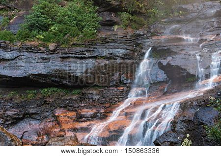 Wentworth Falls lower section waterfall cascade. Water flowing over rocks. Wentworth Falls Blue Mountains National Park Australia