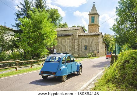 vintage car travel italy countryside church background